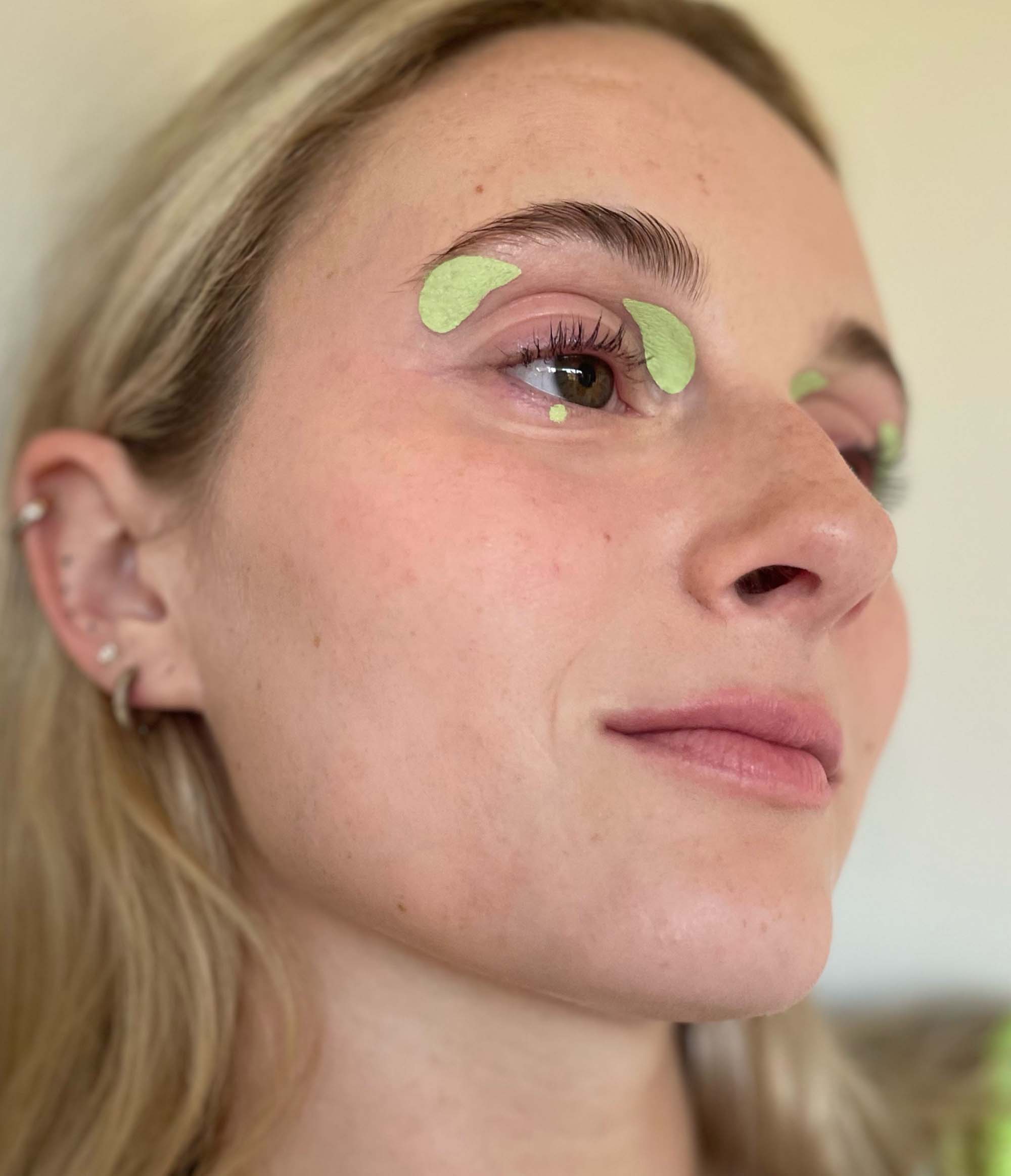 Model with light skin tone wearing Deepdive in Sagebrush on inner and outer eyes and one dot under their eye.