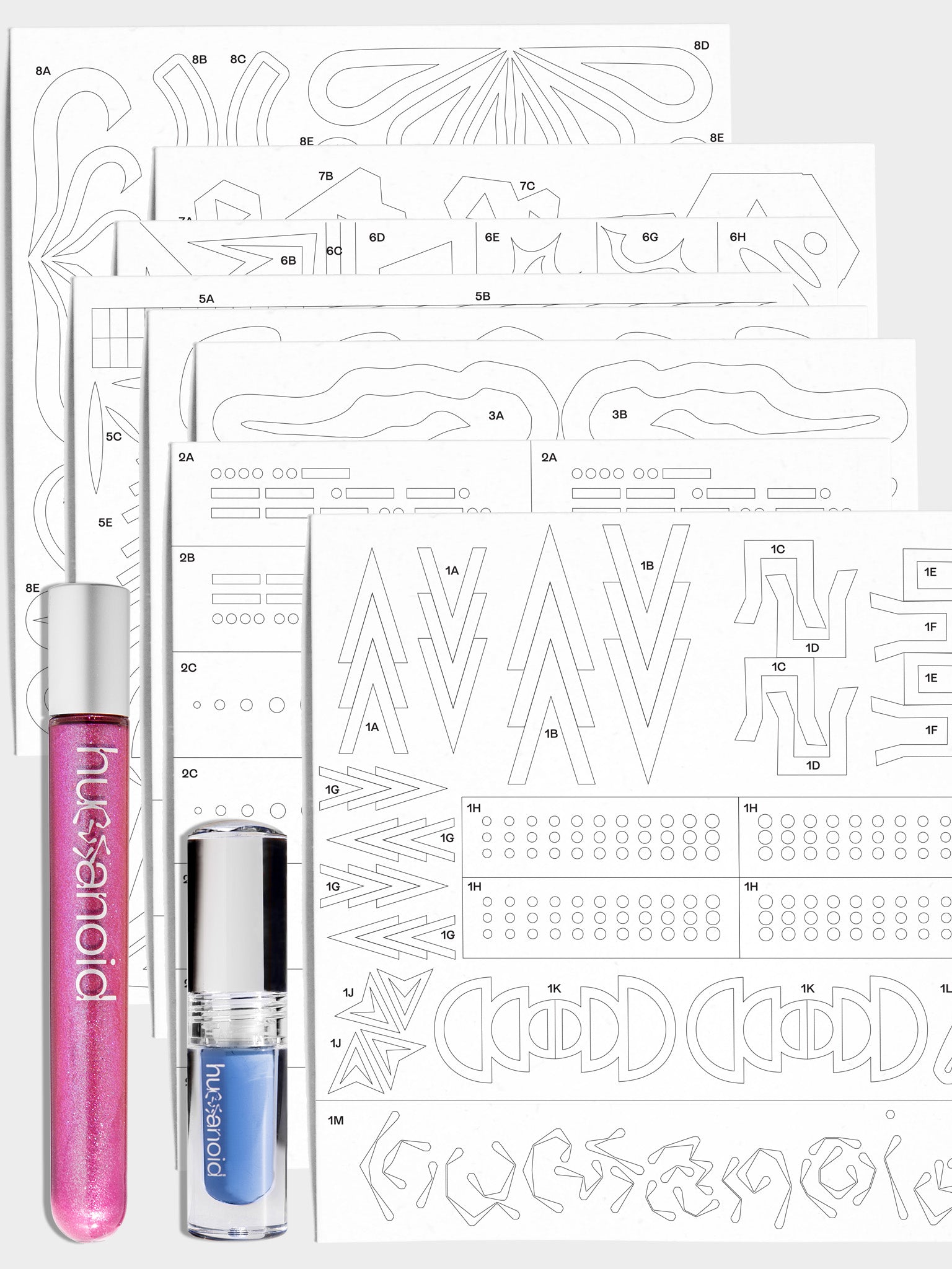 Close up of Trial Bundle with 1 colorwand and 1 deepdive colorpot on top of the 8-page stencil pack