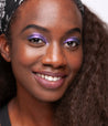 Model with dark skin tone wearing Colorwand in costas on her eyes.