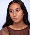 Model with medium skin tone wearing Colorwand in glabra on her eyes.