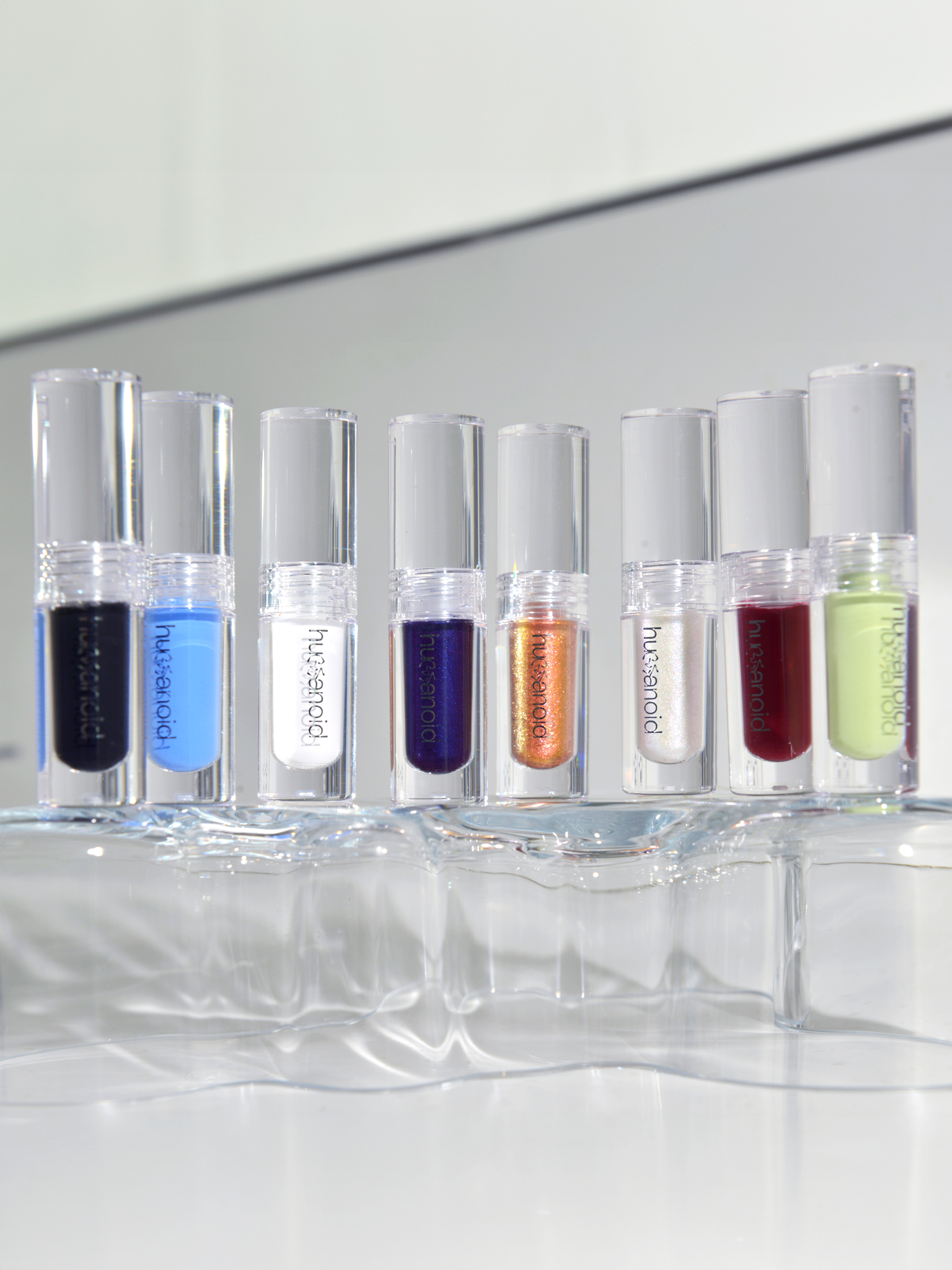Close up of Deepdive colorpot bottles in all colors standing side by side