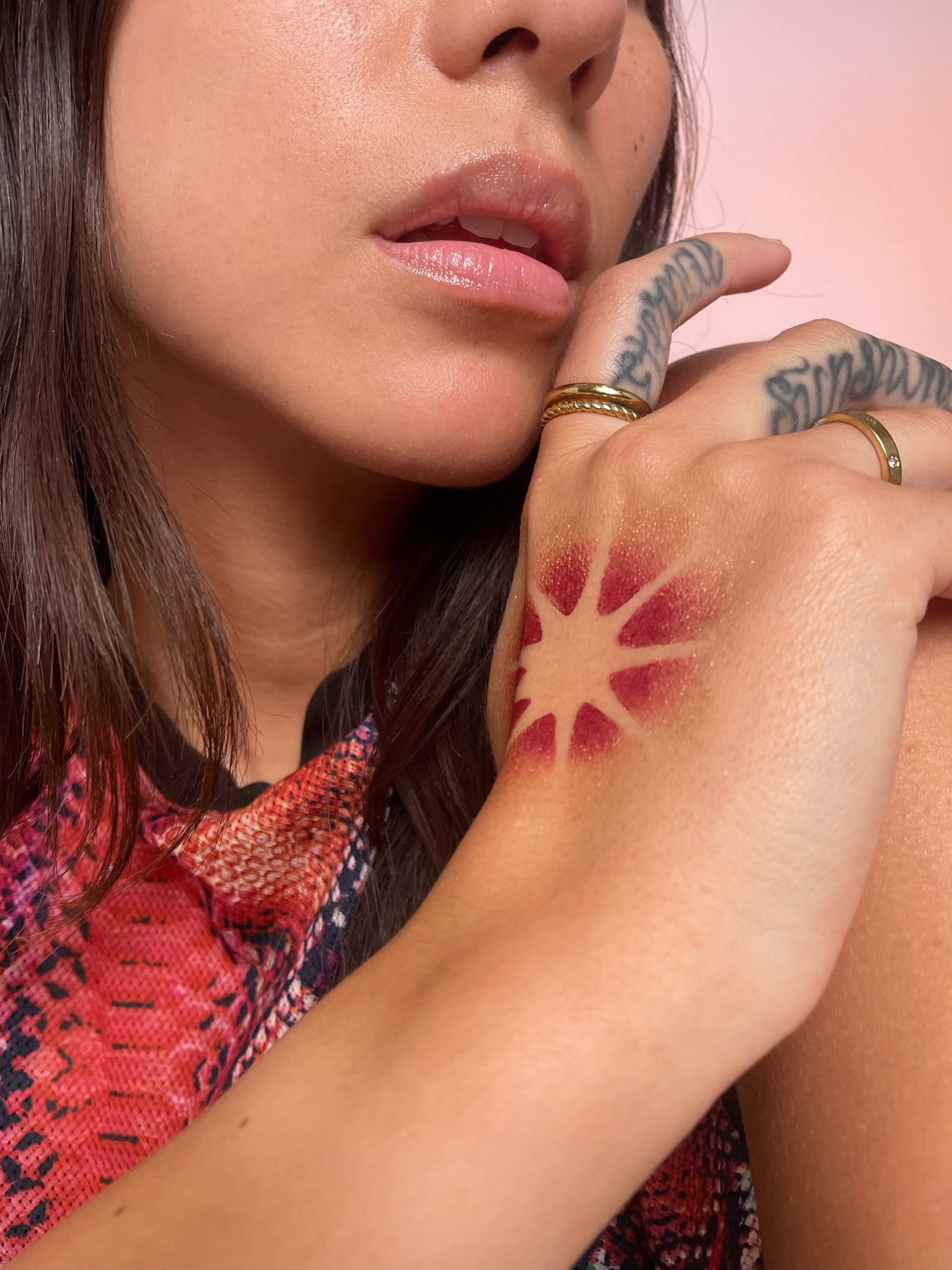 Model with medium skin tone wearing a starburst pattern in Aeonium on their right hand.