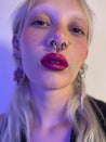 Model wearing Sagebrush under bottom lip with starburst at corners of their mouth.