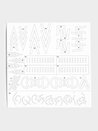 Close up of stencil sheet with various geometric shapes and dots.