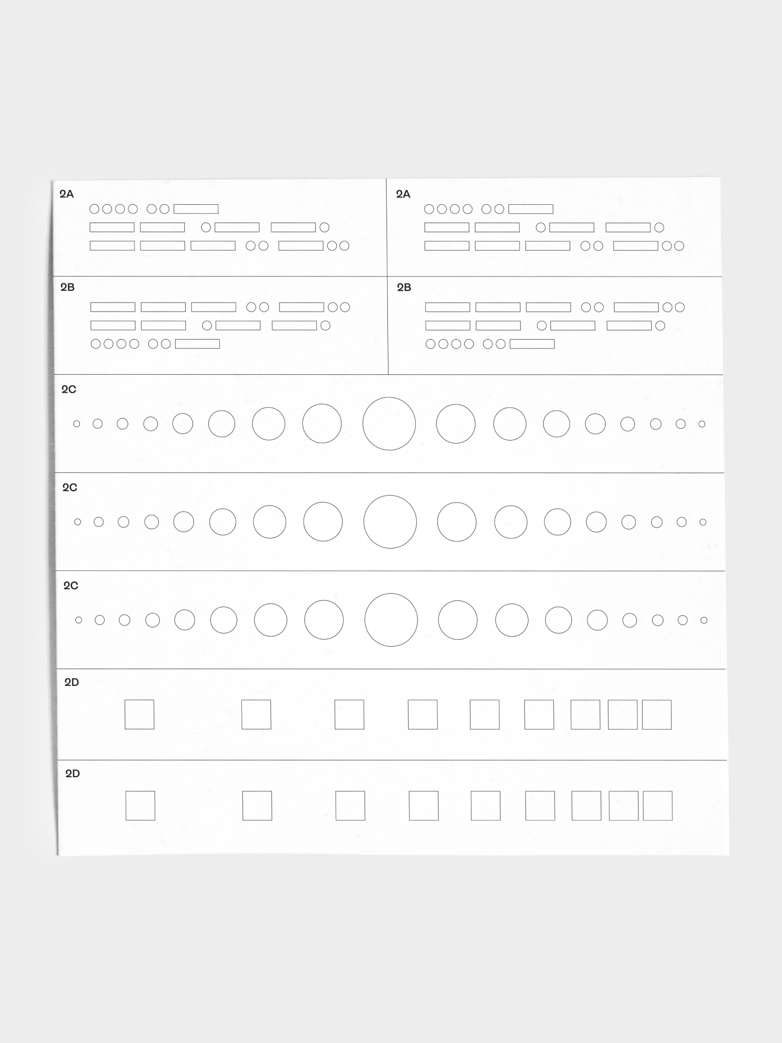 Closeup of stencil sheet with various stripe, dot, and square patterns.