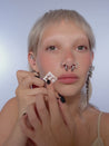 Video of model using stencils on their face.