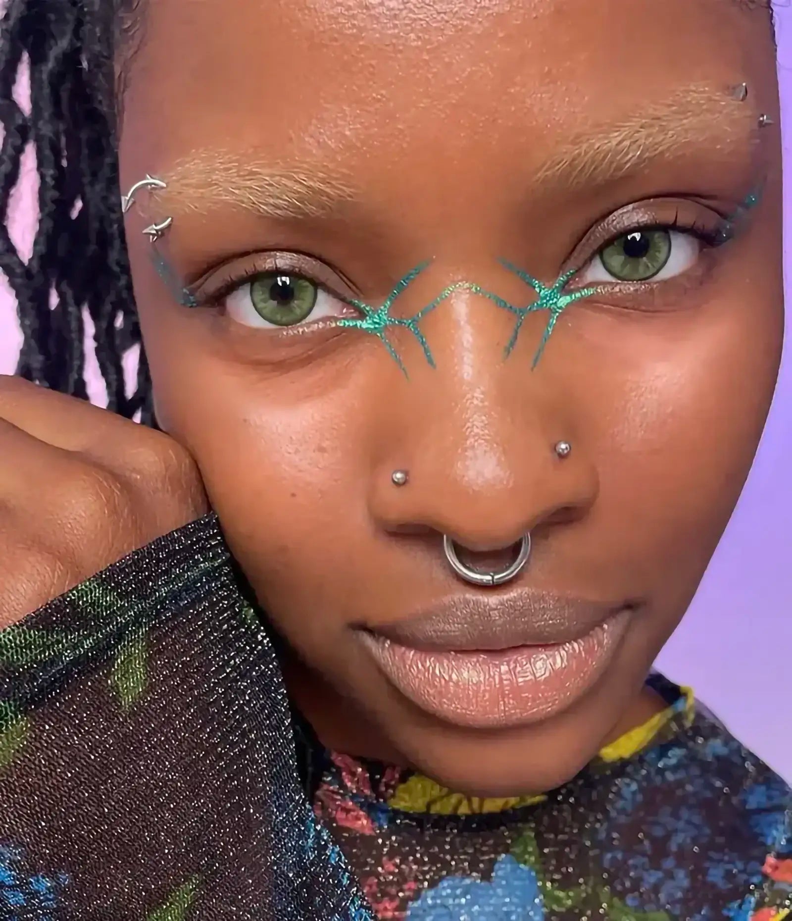 var:figeater | close-up of figeater gel wand makeup worn on eyes showing emerald multi-tone finish